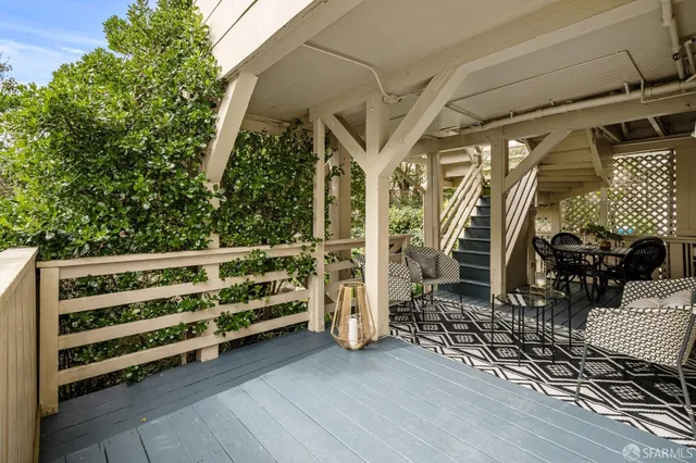 a view of a chairs and table in the patio