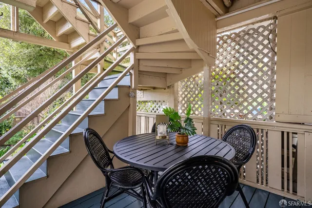 a view of balcony with furniture