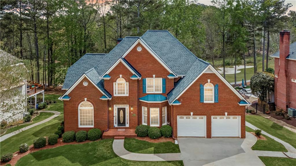 5870 Brookstone Walk Northwest Acworth, GA 30101 - Photo 1 of 79 a front view of a house with a yard