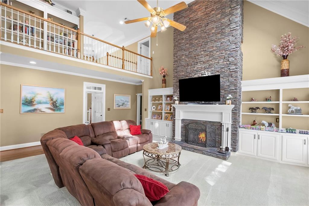 5870 Brookstone Walk Northwest Acworth, GA 30101 - Photo 12 of 79 a living room with furniture a fireplace and a flat screen tv