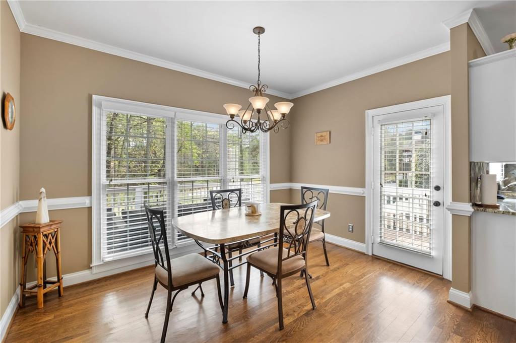 5870 Brookstone Walk Northwest Acworth, GA 30101 - Photo 18 of 79 a dining room with furniture window wooden floor