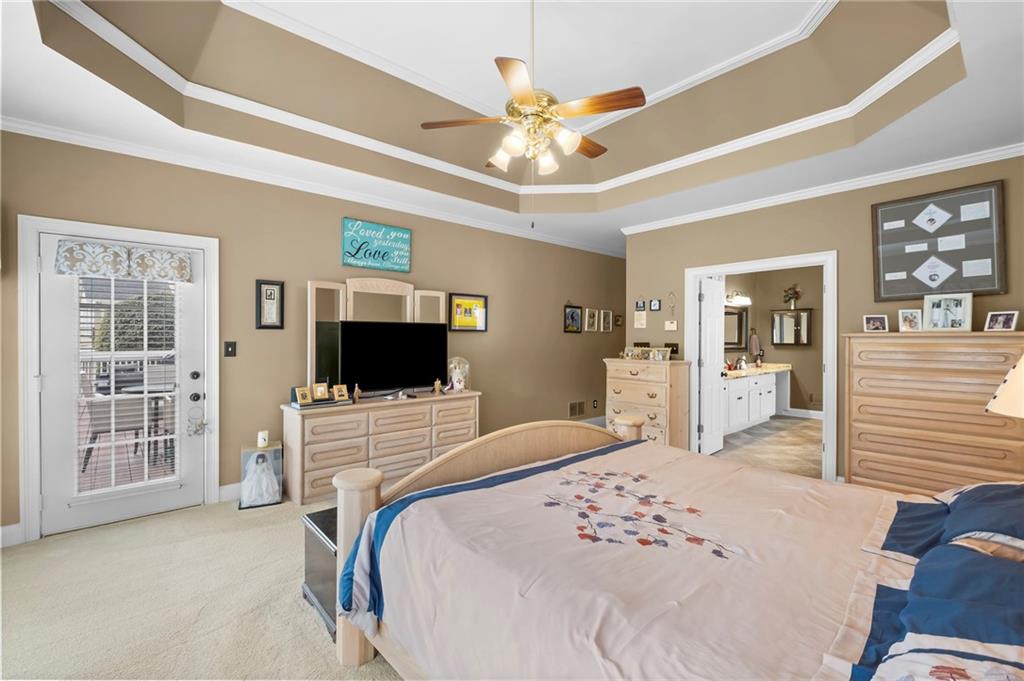 5870 Brookstone Walk Northwest Acworth, GA 30101 - Photo 22 of 79 a bedroom with a bed and a flat screen tv