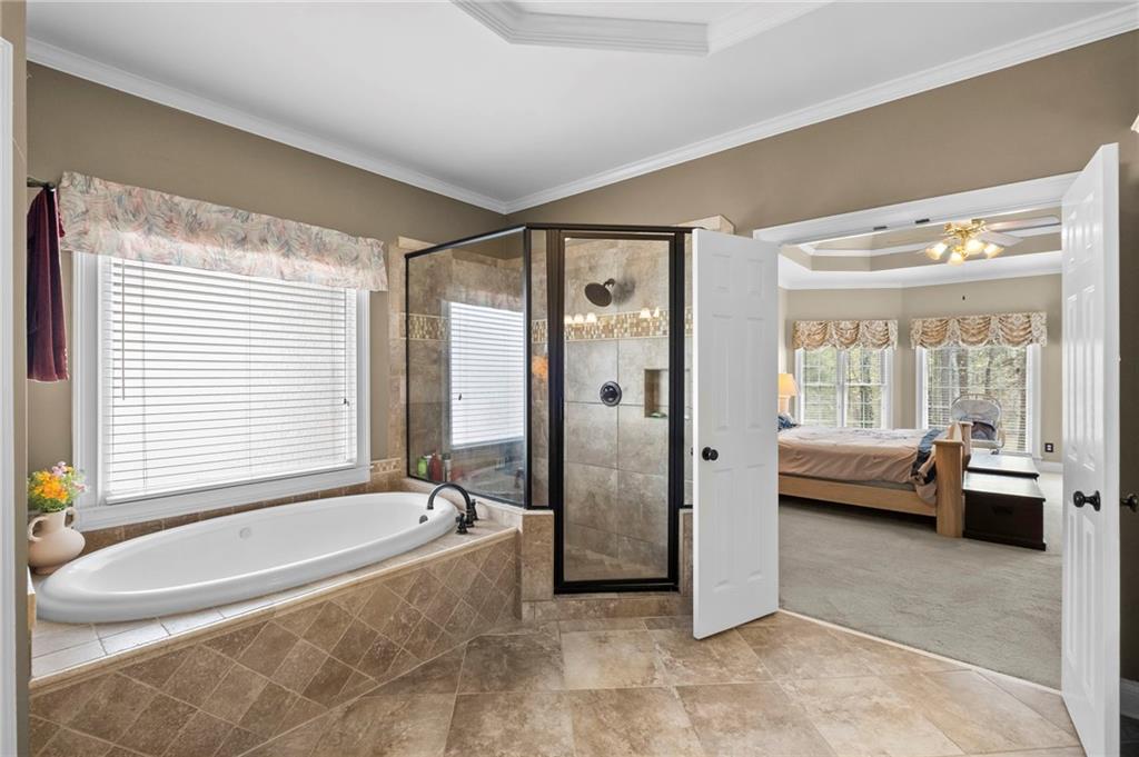 5870 Brookstone Walk Northwest Acworth, GA 30101 - Photo 24 of 79 a spacious bathroom with a tub shower and sink