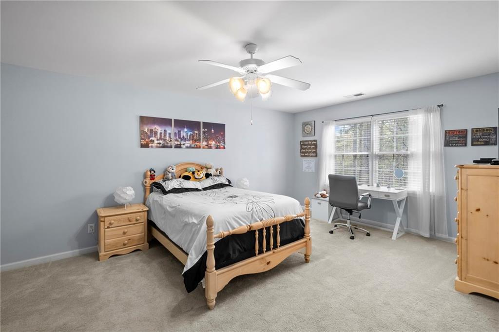 5870 Brookstone Walk Northwest Acworth, GA 30101 - Photo 32 of 79 a bed room with a bed and a window