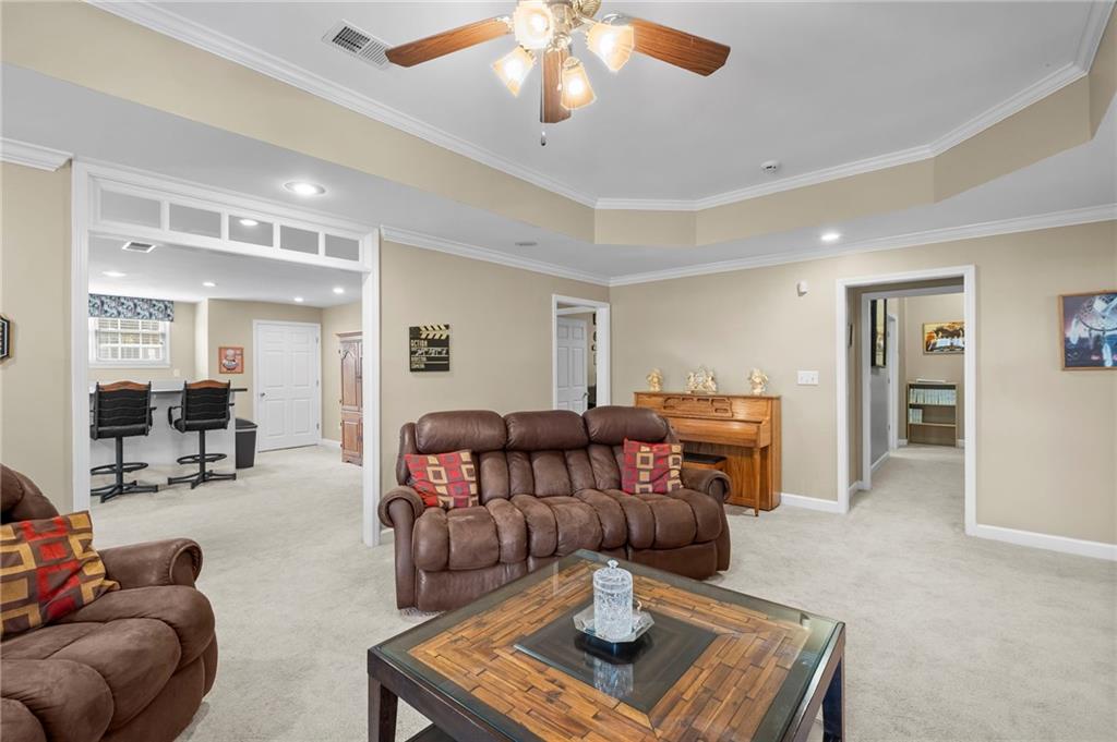 5870 Brookstone Walk Northwest Acworth, GA 30101 - Photo 36 of 79 a living room with furniture and a chandelier