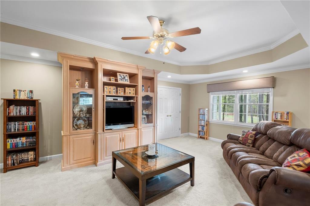 5870 Brookstone Walk Northwest Acworth, GA 30101 - Photo 37 of 79 a living room with furniture and a flat screen tv