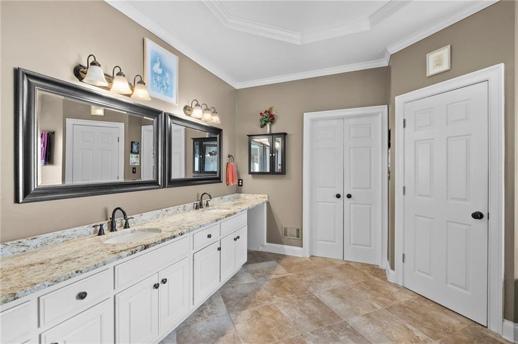 5870 Brookstone Walk Northwest Acworth, GA 30101 - Photo 4 of 79 a bathroom with double vanity sink and a mirror