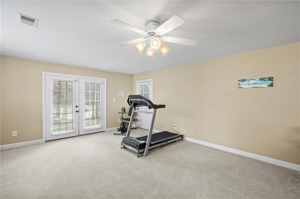 5870 Brookstone Walk Northwest Acworth, GA 30101 - Photo 44 of 79 a room with gym equipment and view of living room
