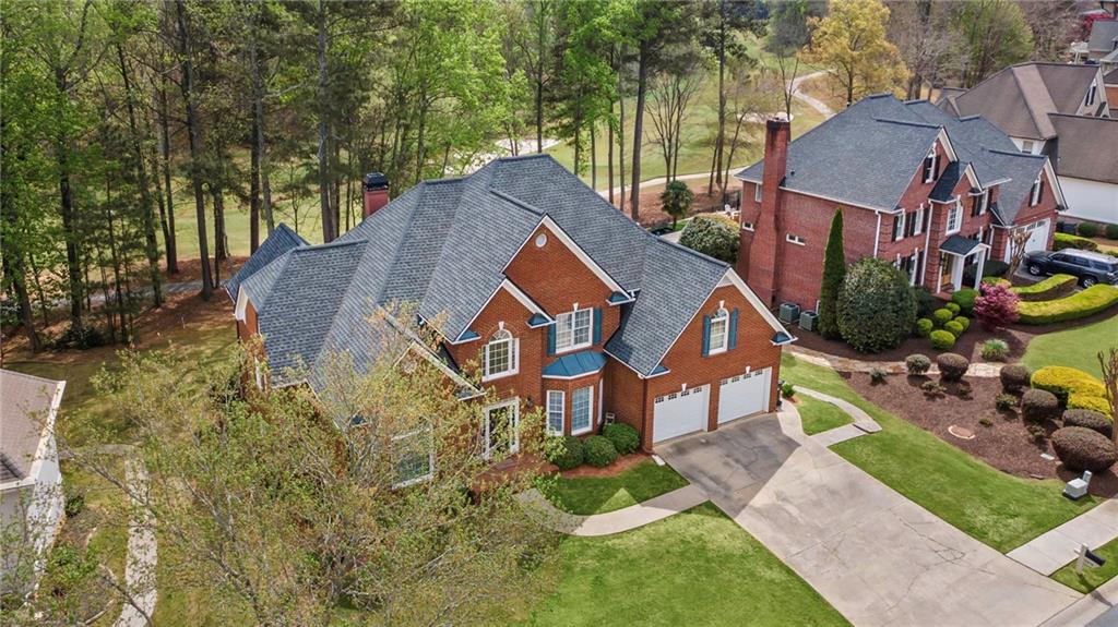 5870 Brookstone Walk Northwest Acworth, GA 30101 - Photo 48 of 79 an aerial view of a house with a yard and a large tree