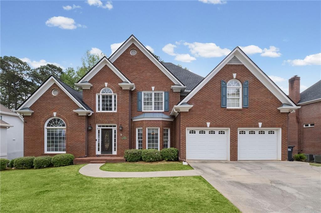 5870 Brookstone Walk Northwest Acworth, GA 30101 - Photo 50 of 79 a front view of a house with a yard and garage