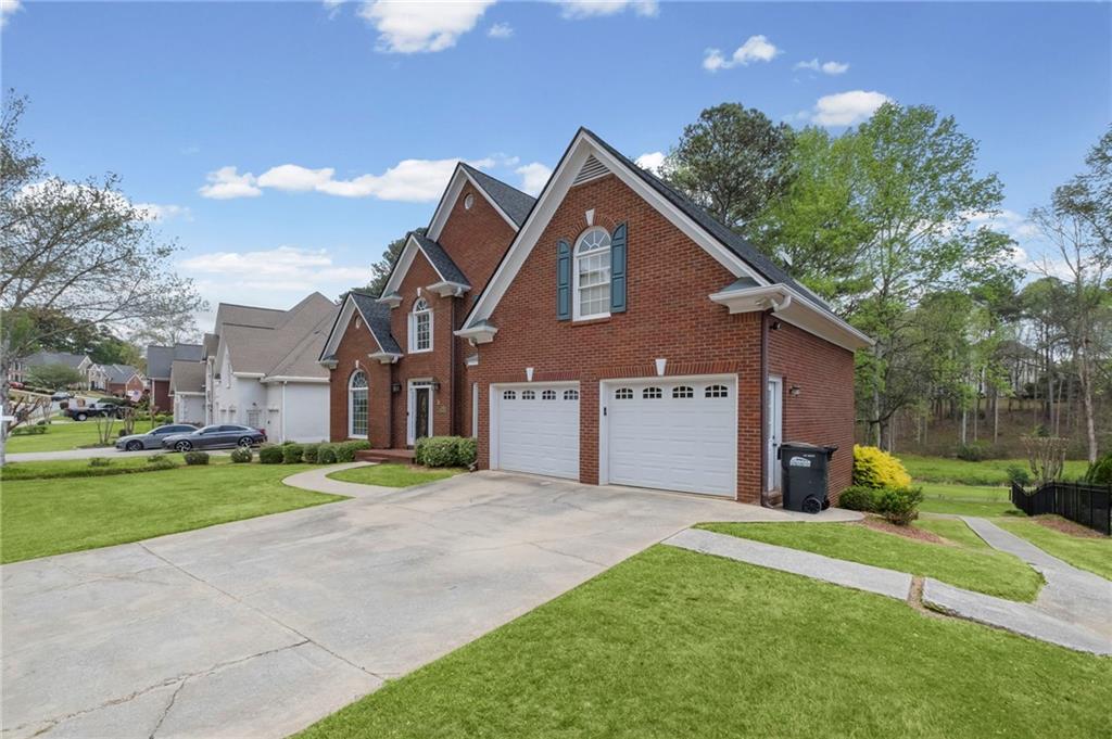 5870 Brookstone Walk Northwest Acworth, GA 30101 - Photo 51 of 79 a front view of a house with a yard and garage