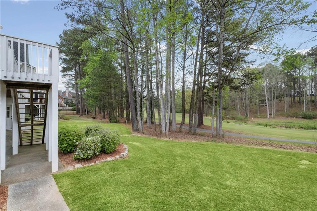 5870 Brookstone Walk Northwest Acworth, GA 30101 - Photo 57 of 79 a view of a backyard with tree s