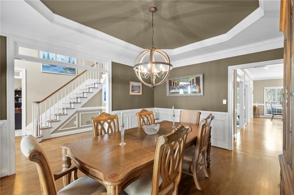 5870 Brookstone Walk Northwest Acworth, GA 30101 - Photo 10 of 79 a view of a dining room with furniture wooden floor and chandelier