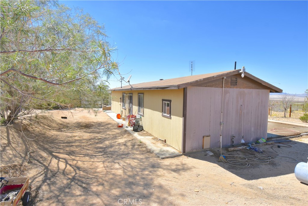 50770 Ocotillo Road Johnson Valley, CA 92285 - Photo 1 of 1 a view of a house with backyard and sitting area