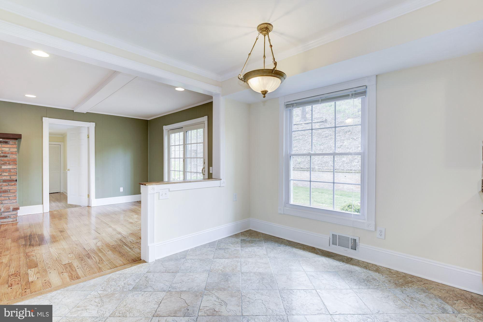 8524 Fox Run Potomac, MD 20854 - Photo 14 of 30 a view of an empty room with window and wooden floor