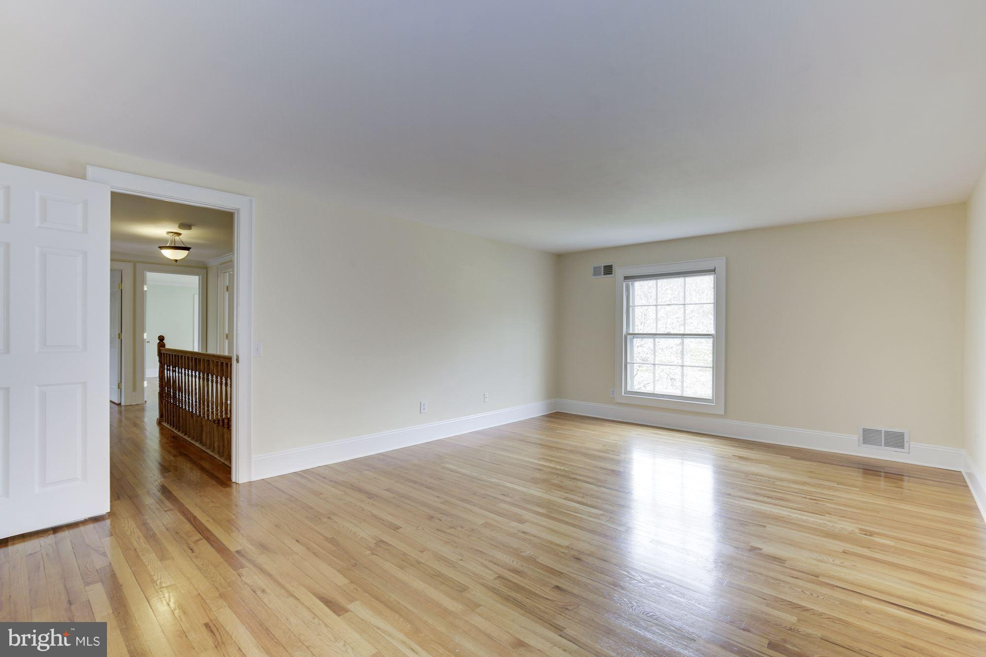 8524 Fox Run Potomac, MD 20854 - Photo 16 of 30 wooden floor in an empty room with a window