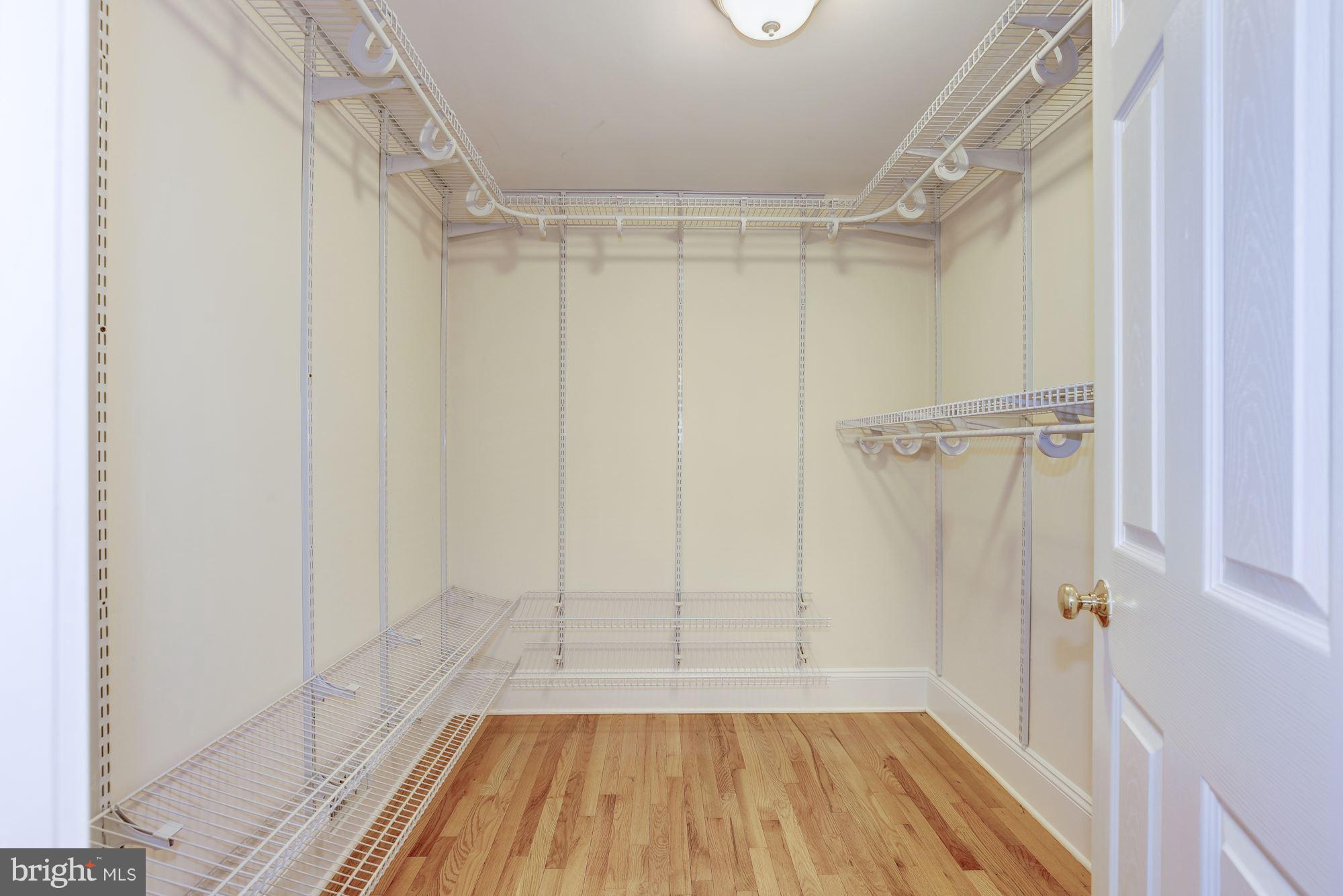 8524 Fox Run Potomac, MD 20854 - Photo 18 of 30 a view of walk in closet with empty racks