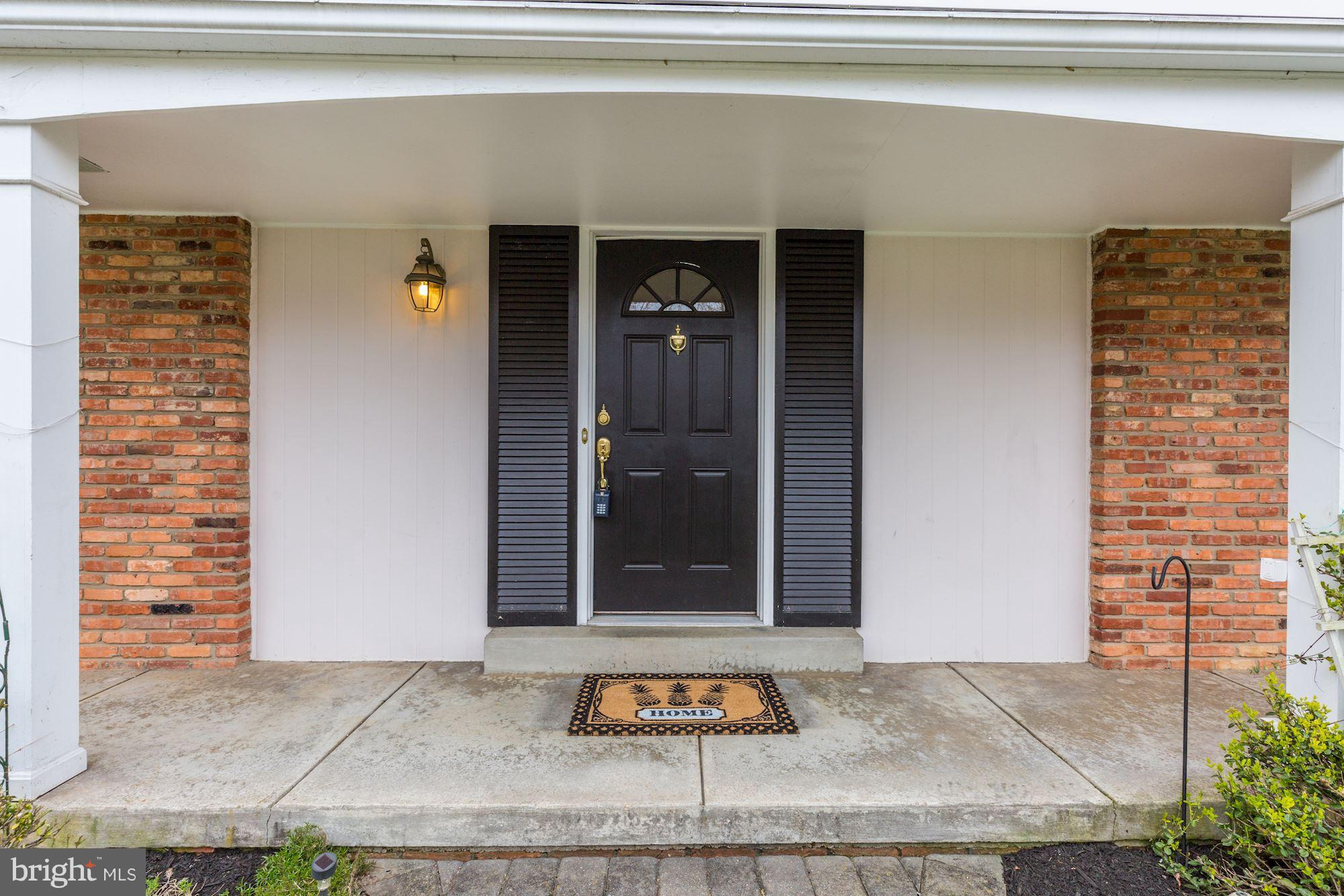8524 Fox Run Potomac, MD 20854 - Photo 3 of 30 a view of entrance door of the house