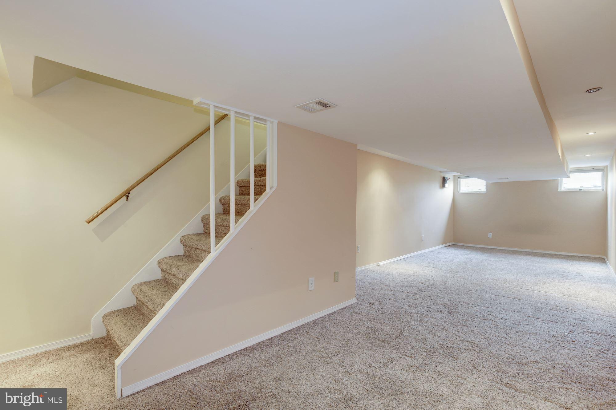 8524 Fox Run Potomac, MD 20854 - Photo 25 of 30 a view of an empty room with stairs