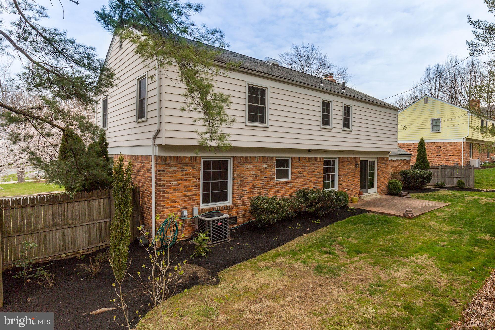 8524 Fox Run Potomac, MD 20854 - Photo 27 of 30 a front view of house with yard and outdoor seating