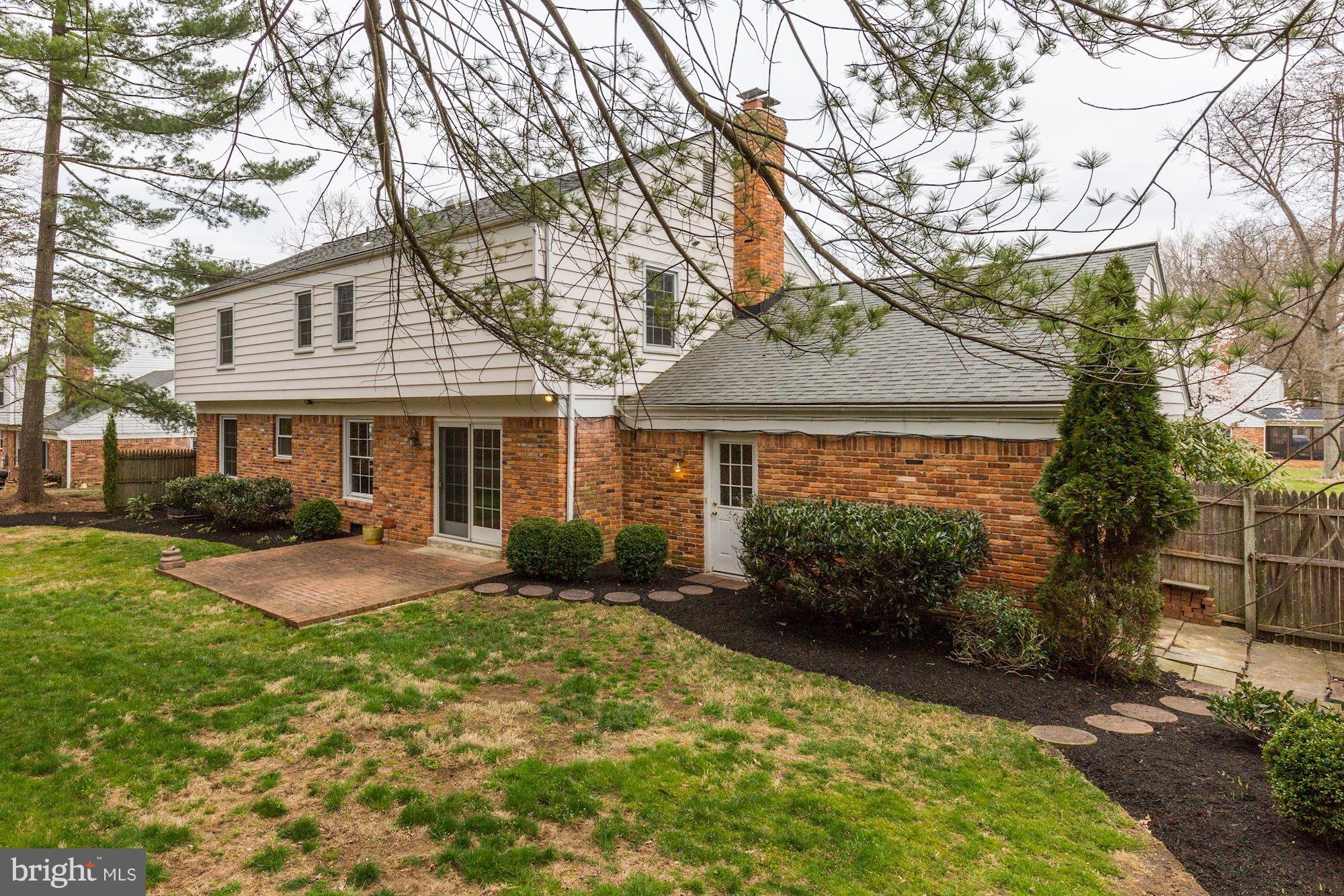 8524 Fox Run Potomac, MD 20854 - Photo 29 of 30 a front view of a house with garden and porch