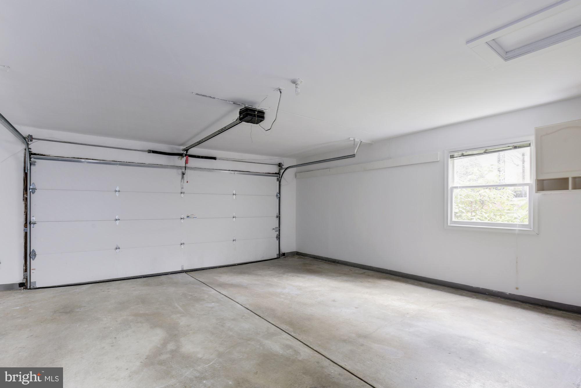 8524 Fox Run Potomac, MD 20854 - Photo 30 of 30 an empty room with a ceiling fan and window