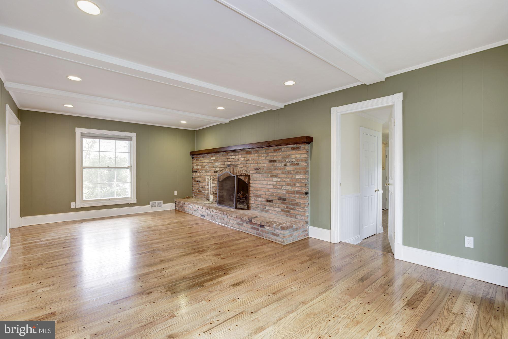 8524 Fox Run Potomac, MD 20854 - Photo 7 of 30 an empty room with windows and fireplace