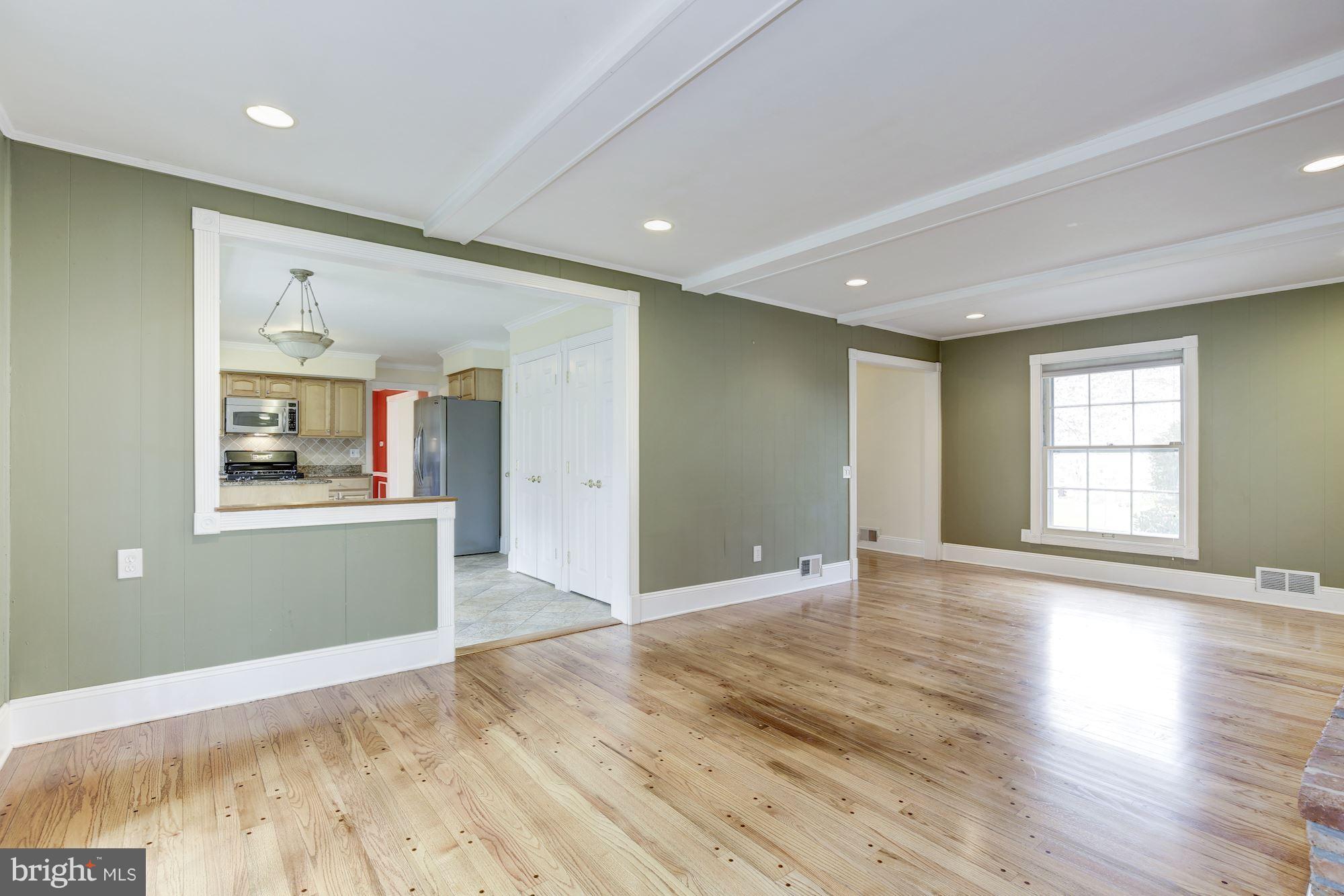 8524 Fox Run Potomac, MD 20854 - Photo 8 of 30 a view of an empty room with wooden floor and a window
