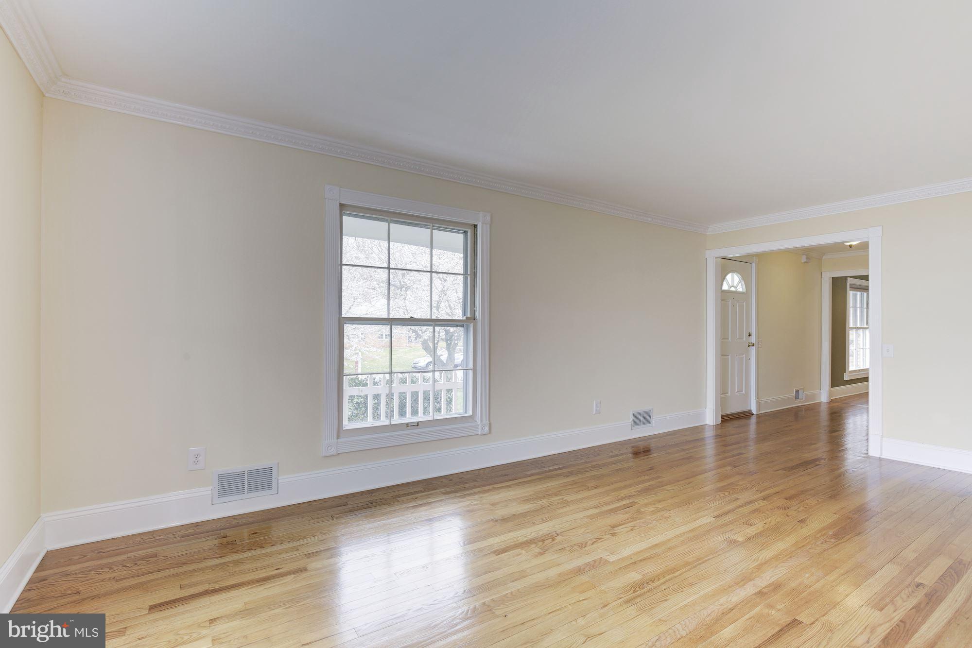 8524 Fox Run Potomac, MD 20854 - Photo 10 of 30 an empty room with wooden floor and windows