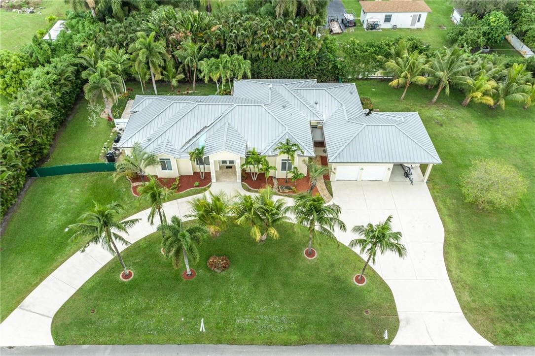 16901 Southwest 63rd Manor Southwest Ranches, FL 33331 - Photo 3 of 53 an aerial view of a house with swimming pool garden and patio
