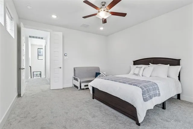 a bathroom with a shower sink and mirror