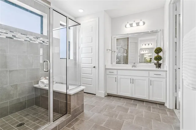 a large white bed in a white room