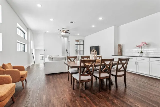 a view of a dining room with furniture and wooden floor