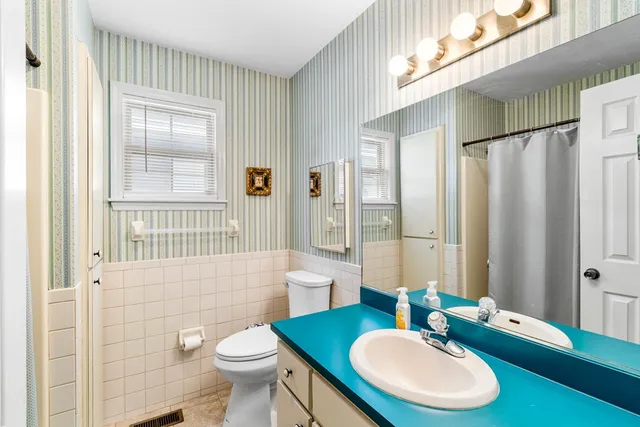 a view of a backyard with a garden and trees