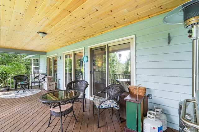 a bathroom with a sink a toilet and shower curtain