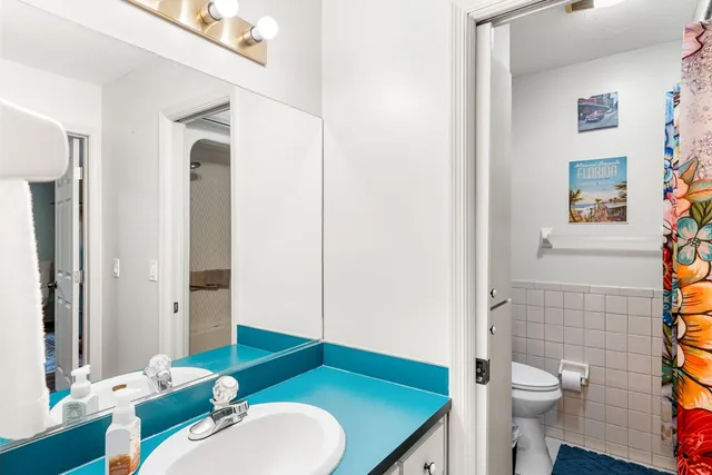 a kitchen with a stove a microwave and wooden cabinets