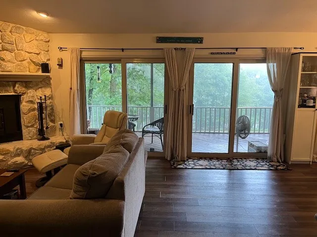 a living room with furniture and a large window