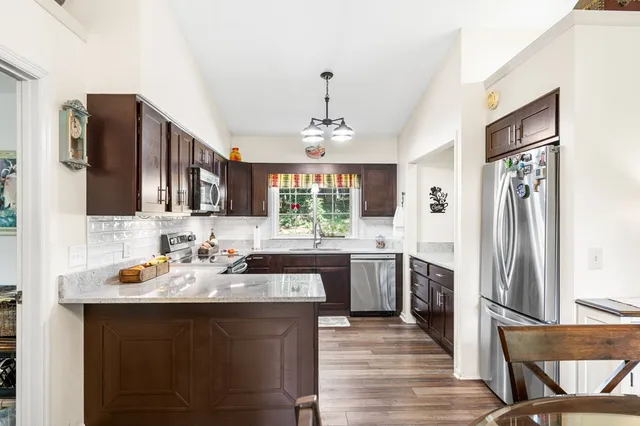 a view of balcony with furniture and garden