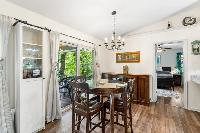 a view of a house with yard and sitting area