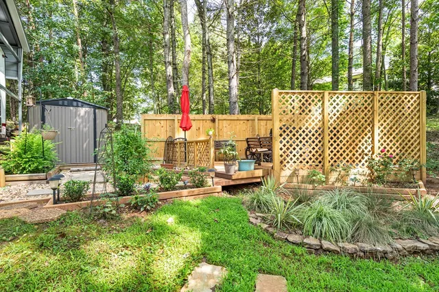 a view of a house with swimming pool and sitting area