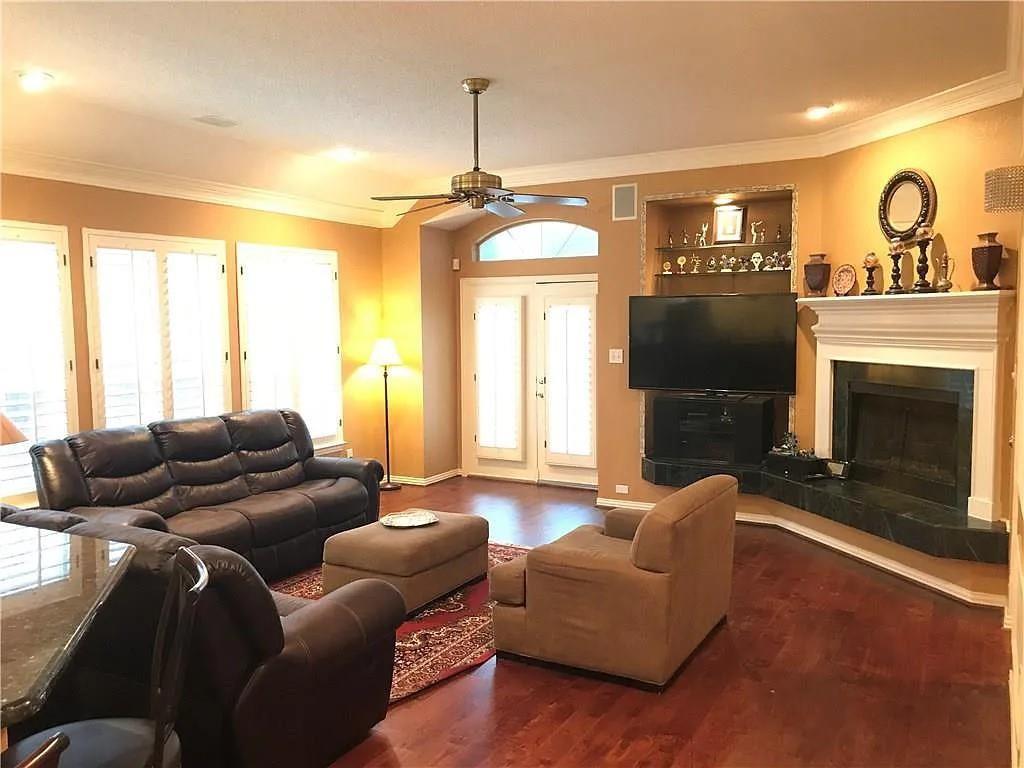 9400 Western Trail Irving, TX 75063 - Photo 17 of 24 a living room with furniture and a fireplace