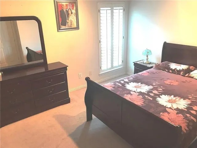 a living room with furniture a window and a fireplace