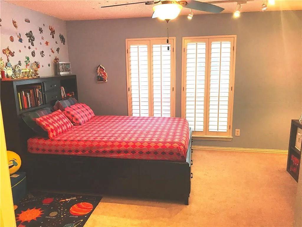 9400 Western Trail Irving, TX 75063 - Photo 21 of 24 a bedroom with a bed and a window
