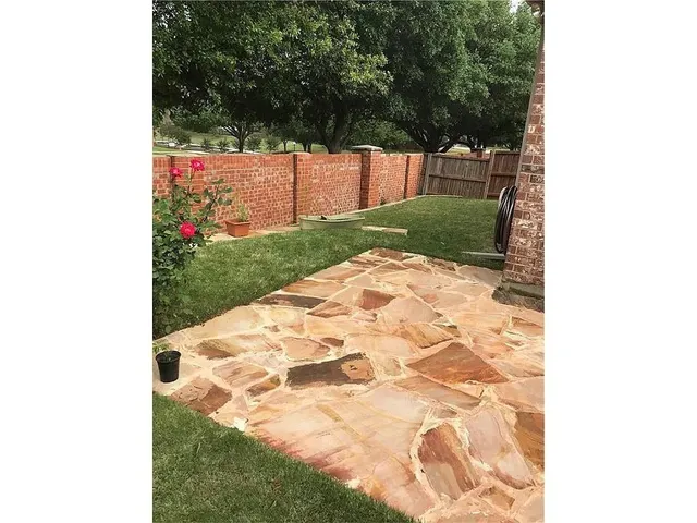 a view of a backyard with garden