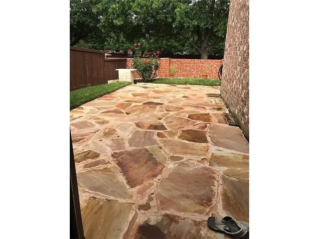 a bedroom with a bed and a white wall