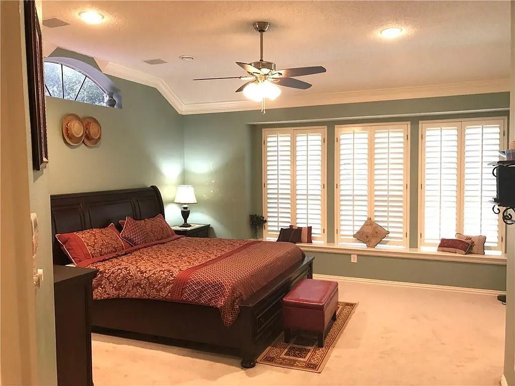 9400 Western Trail Irving, TX 75063 - Photo 10 of 24 a bedroom with a large bed and a large window
