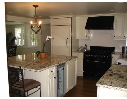 29 Jefferson Road Wellesley, MA 02481 - Photo 2 of 14 a kitchen with kitchen island granite countertop a sink a stove and refrigerator