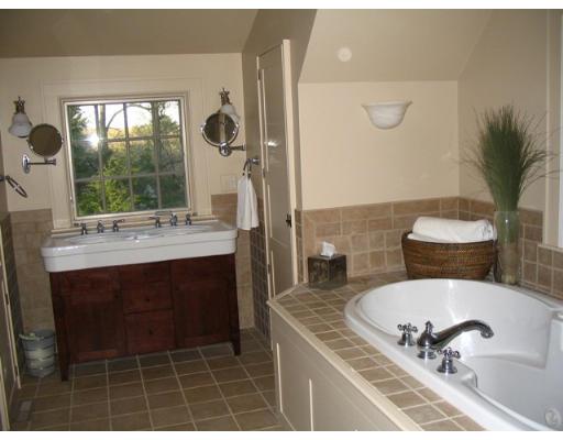 29 Jefferson Road Wellesley, MA 02481 - Photo 8 of 14 a bathroom with a sink a mirror and a shower