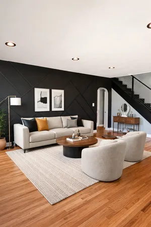 a living room with furniture and a wooden floor