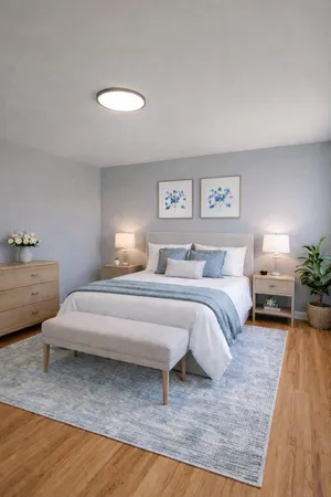 a bedroom with a bed and a table